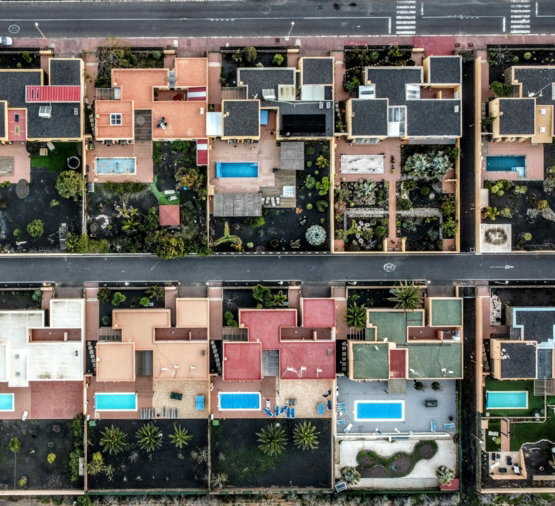 an aerial view of a city with lots of houses